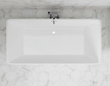 White rectangular sink with a faucet on a black hexagonal tiled wall