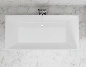 White rectangular sink with a faucet on a black hexagonal tiled wall