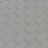 Oyster gray subway 11.88X13.88 glass mesh mounted mosaic tile SMOT GLSST OYGR8MM product shot multiple tiles angle view