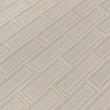 Portico pearl beveled 12X12 glossy ceramic mesh mounted mosaic tile SMOT-PT-PORPEA-2X6B product shot multiple tiles angle view