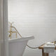 Whisper white beveled 12X12 ceramic mesh mounted mosaic wall tile SMOT-PT-WW-2X6B product shot multiple tiles angle view