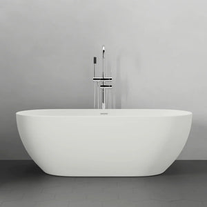 White freestanding bathtub against a gray wall