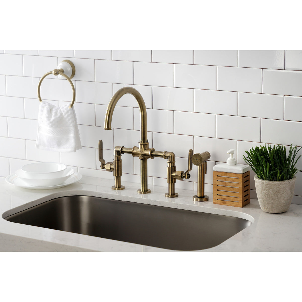 Kingston Brass KS2333KL Whitaker Industrial Style Bridge Kitchen Faucet with Brass Sprayer, Antique Brass