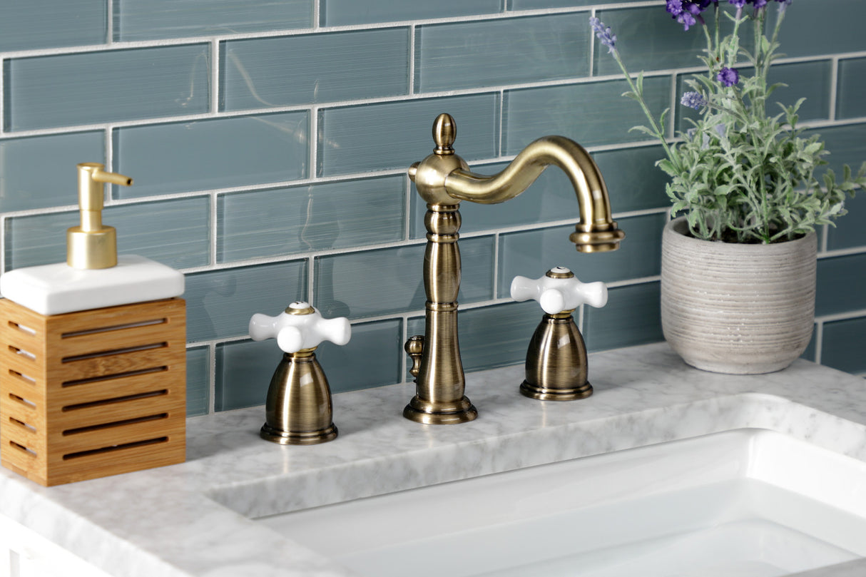 Kingston Brass KB1973PX Heritage Widespread Bathroom Faucet with Brass Pop-Up, Antique Brass