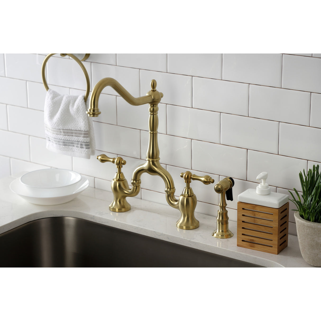 Kingston Brass KS7757ALBS 8" Bridge Kitchen Faucet with Sprayer, Brushed Brass