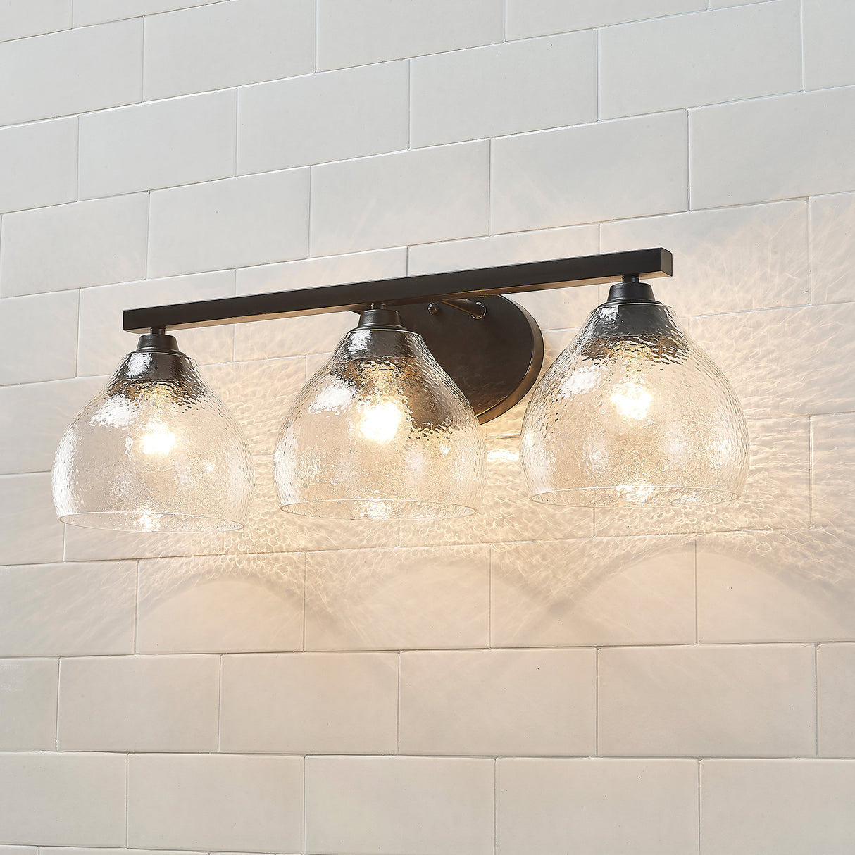 Ariella 3-Light Bath Vanity in Matte Black with Hammered Clear Glass