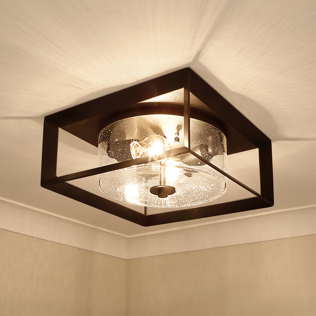 Smyth Outdoor Flush Mount in Natural Black with Seeded Glass