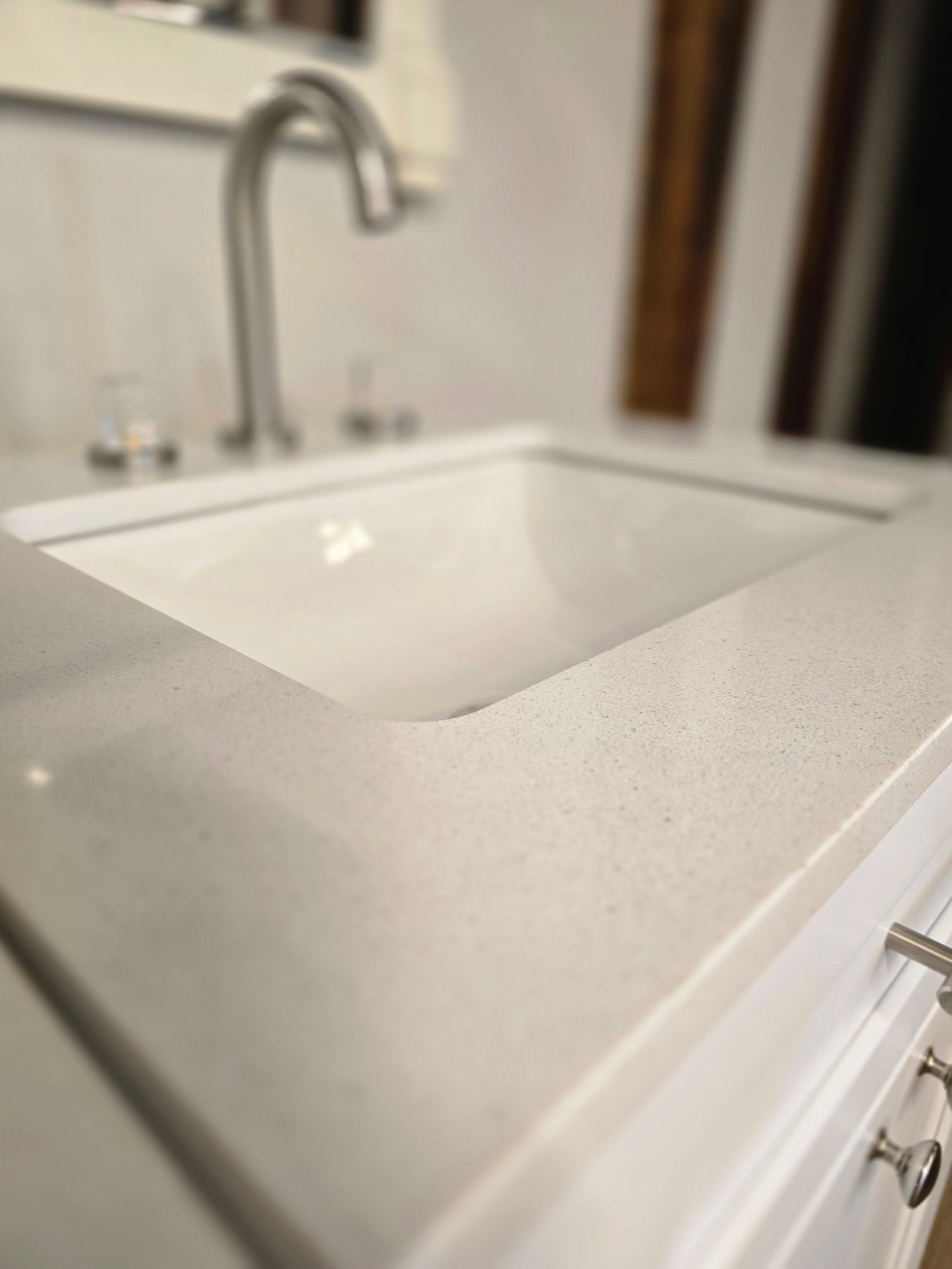 24" White Cabtec Vanity Set with Custom Quartz Top and Fasetted Brushed Nickel Faucet