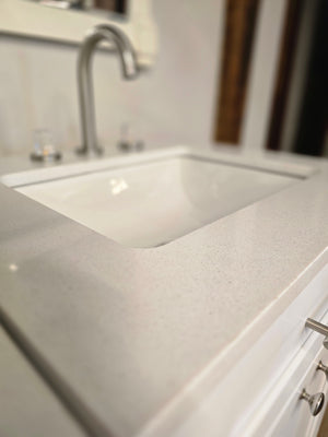 24" White Cabtec Vanity Set with Custom Quartz Top and Fasetted Brushed Nickel Faucet