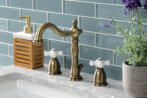 Kingston Brass KB1973PX Heritage Widespread Bathroom Faucet with Brass Pop-Up, Antique Brass