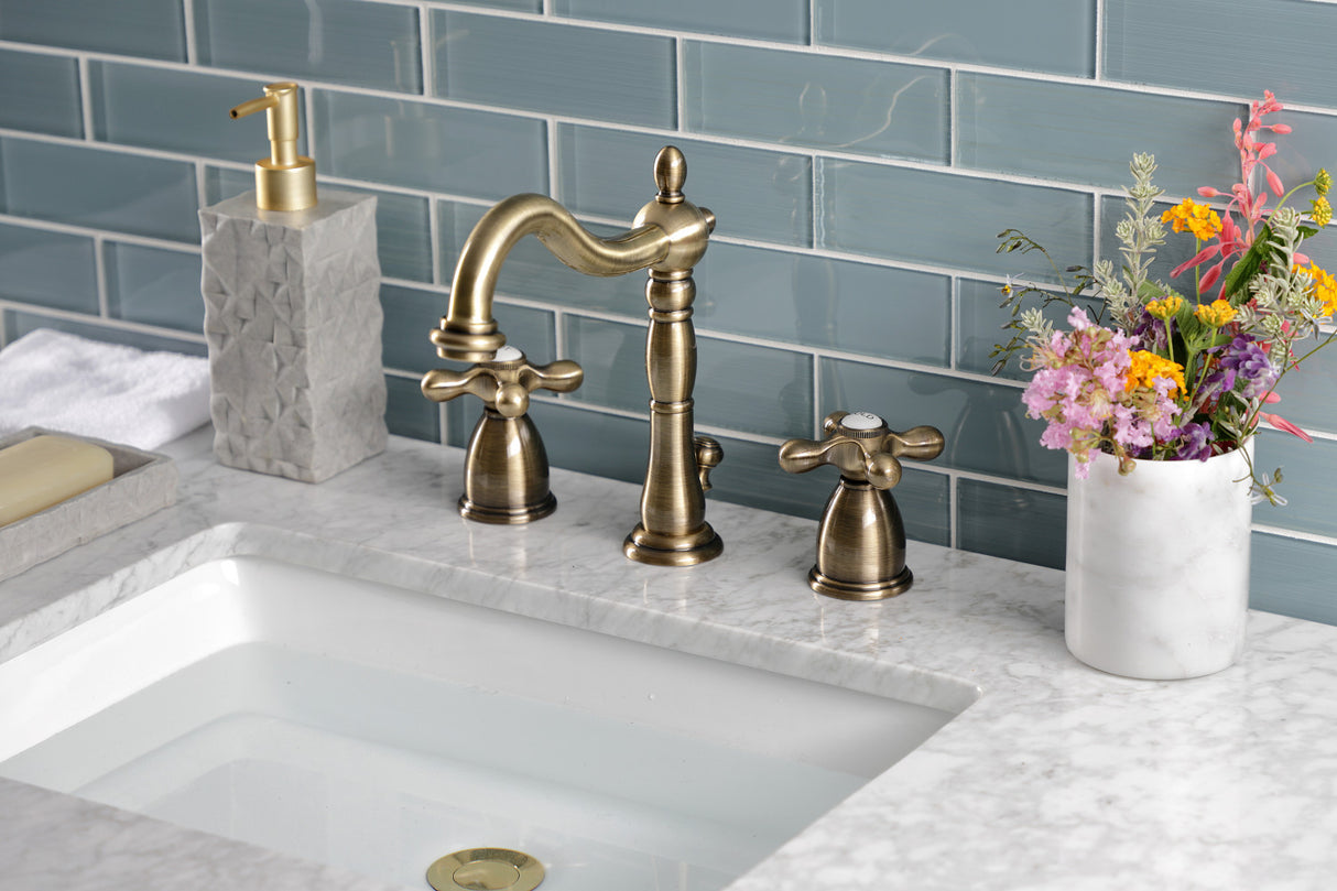 Kingston Brass KB1973AX Heritage Widespread Bathroom Faucet with Brass Pop-Up, Antique Brass